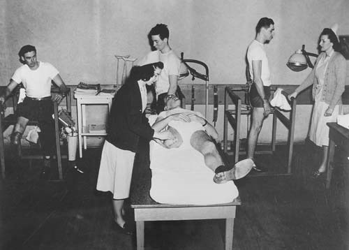 Nurses care for amputee soldiers at Letterman Hospital during World War II.  Significant advances in the field of orthopedics and physical therapy were made during the period.