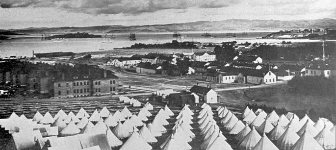 Photo of the Main Post area with tent camp in foreground and bay behind during the Spanish American War.
