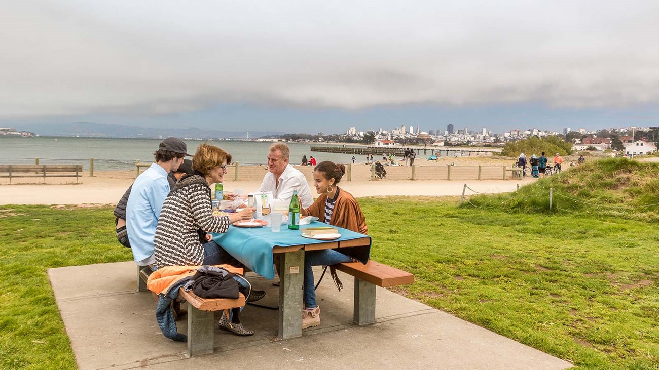people eat on picnic table at crissy field