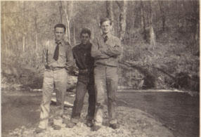 3 ccc boys stand by river