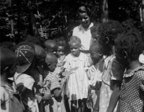 children gather around a craft