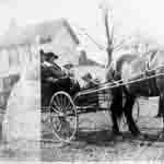 Taylor family in horse drawn wagon