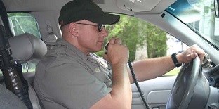 Law enforcement ranger in his vehicle Law enforcement ranger in his vehicle