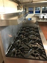 10 burner stove and griddle in the cabin camps