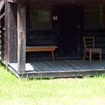 Bench on porch on a porch of a cabin