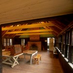 Tables and bench inside a craft lodge