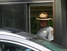 Ranger collecting fees at the entrance station