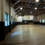 Empty interior of large theatre building at Camp 4