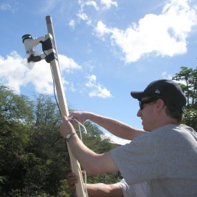 A volunteer sets up a bat monitoring station near the John Young Homestead (2009).