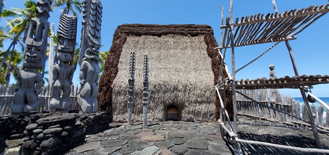 A close up image of Hale o Keawe with accompanying kiʻi and lele tower