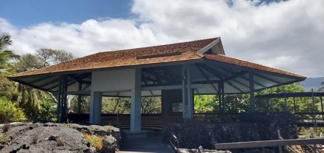 The open air amphitheater at Puʻuhonua o Hōnaunau NHP surrounded by native vegetation.