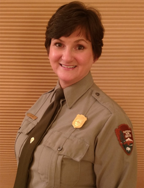 Woman with short brown hair in a uniform