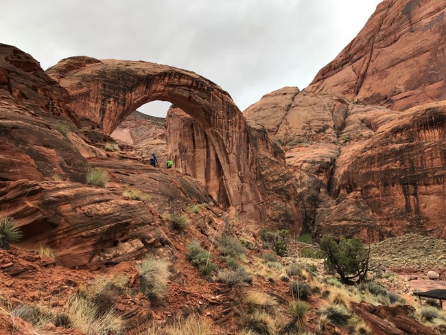 Sandstone cliffs and arch in the rain