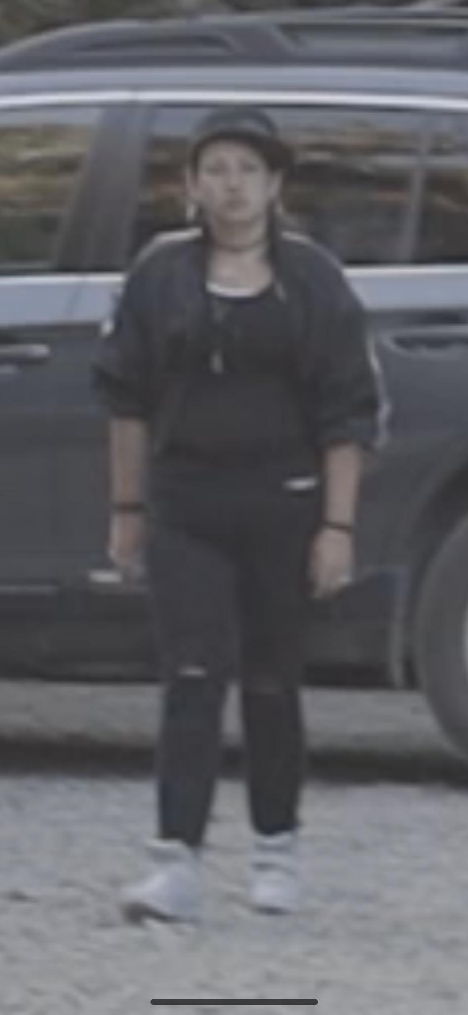 Theft Suspect at Scene A women walking away from a car
