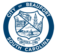City of Beaufort Logo "City of Beaufort, South Carolina" written in a circle around a shield with a historic house, church tower, and boat in a bay. Under the shield is a banner "Founded 1711."