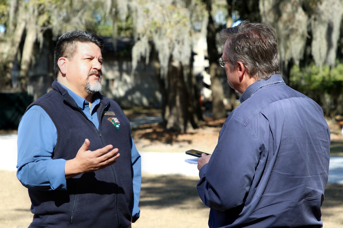Chuck Sams, Director of the National Park Service talks to a reporter.