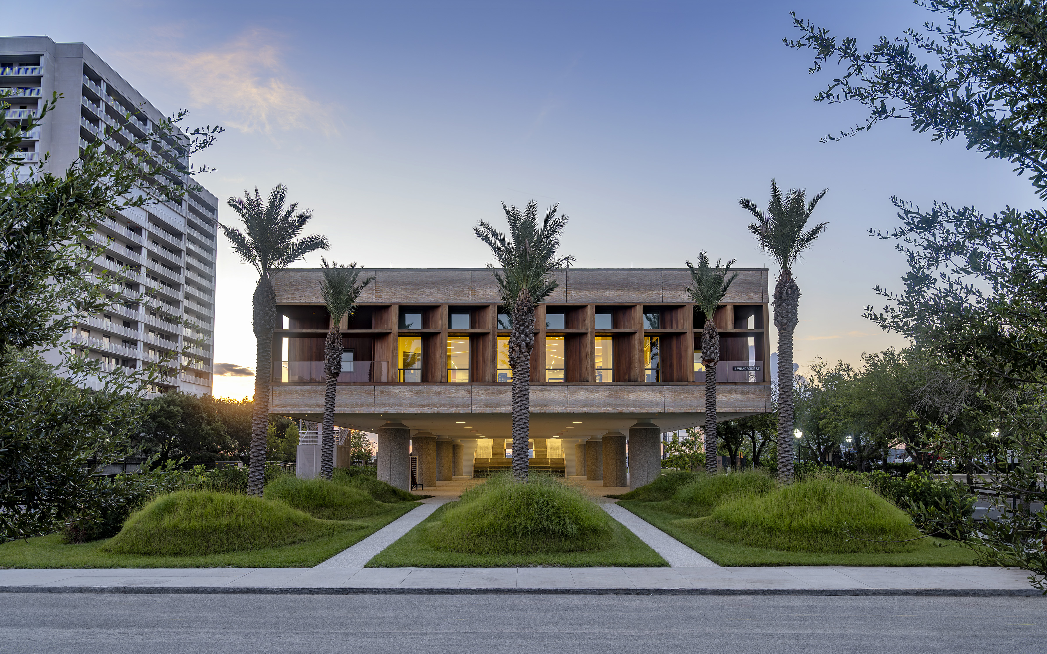 International African American Museum - credit - Sahar Coston-Hardy The International African American Museum in Charleston is a multi story modern structure with vertical pillars and illuminated windows