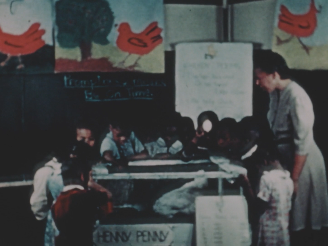 A screen shot from a 1940s documentary showing young African American students in a classroom