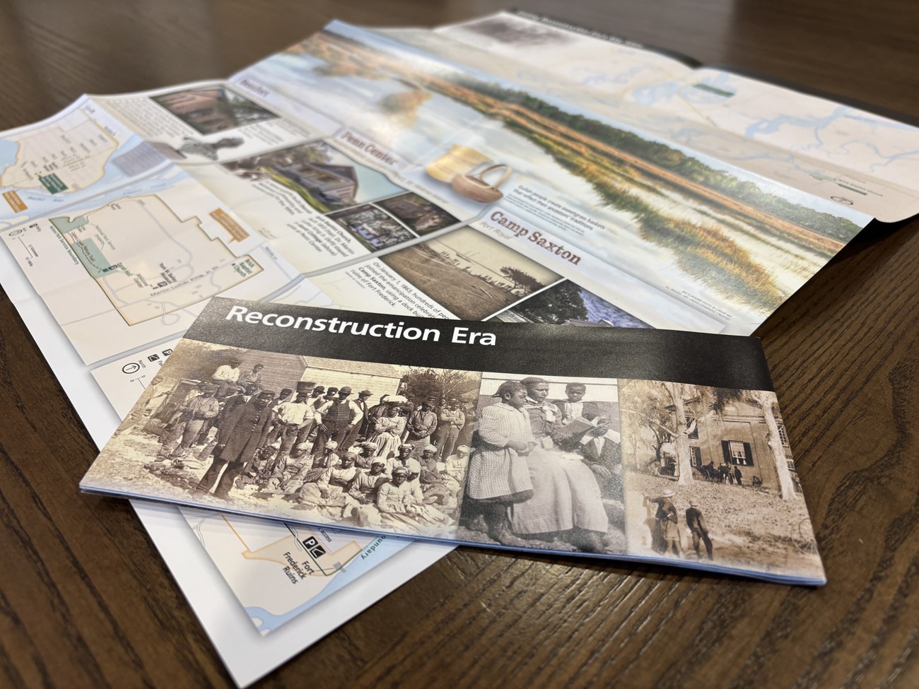 A brochure for the Reconstruction era lying on an open version of the same brochure.