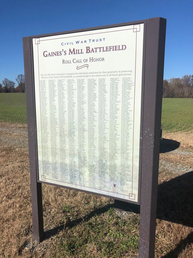 A sign listing the American Battlefield Trust donors of a battlefield