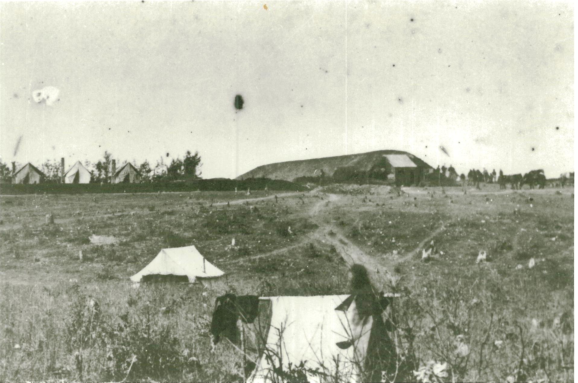 This wartime view shows how the Great Traverse towered over the eastern wall of Fort Harrison, which is the low dark line running through the center of the image.