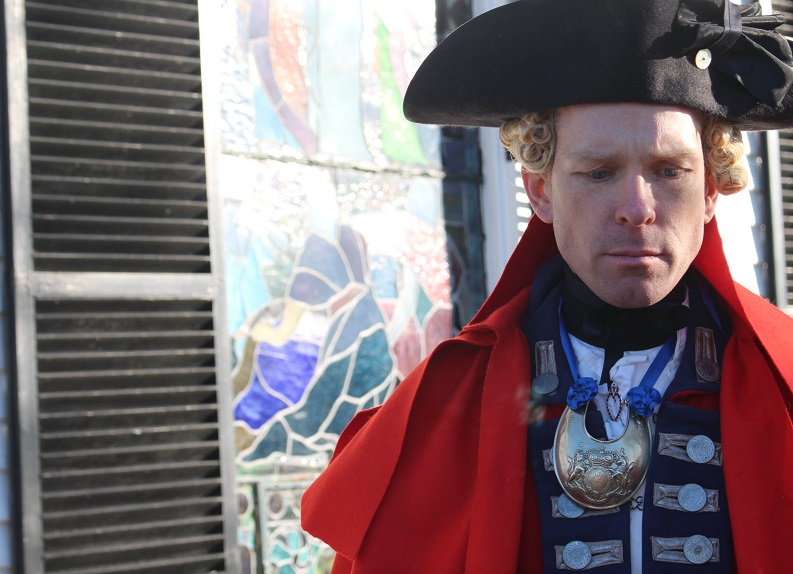 Arnolds Raid 2022 resized A living history reenactor in a red coat and tricorner hat.