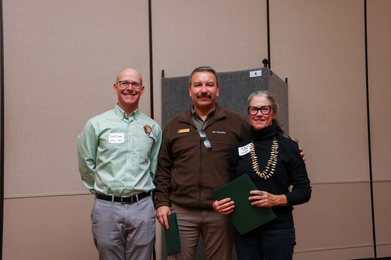 2024 Stewardship Award Three people standing together during the 2024 Stewardship Award Presentation