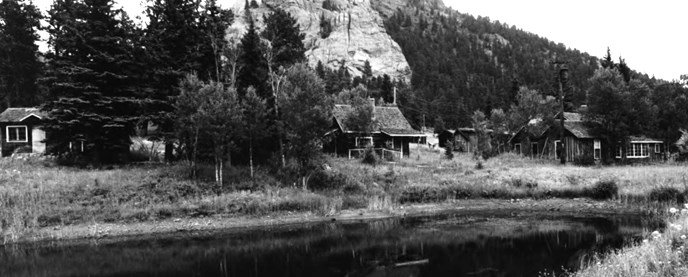 Old photo of McGraw Ranch cabins and pond.