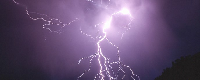 Lightning Bolt against a night sky.