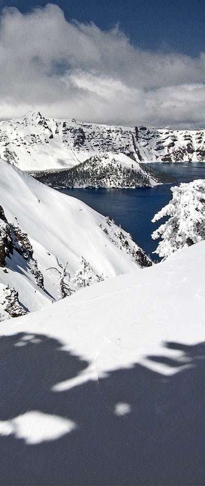 The rim of Crater Lake covered in snow.