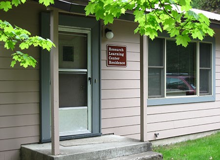 Close up of front door and residence sign.