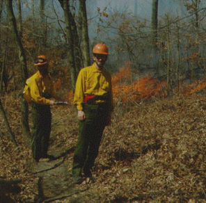 lt= Dr. Ralph Grundel at a prescribed burn