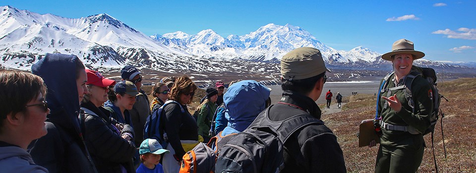 ranger speaks with large group in front of mount denali ranger speaks with large group in front of mount denali