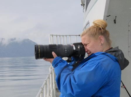 Chelsea shooting photos from deck of boat