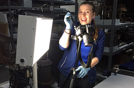 Shay photographing an artifact from the park's natural history collection.