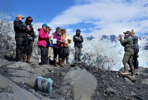 Teacher Workshop BP 0856-4 Teachers stand on a hillside overlooking a glacier