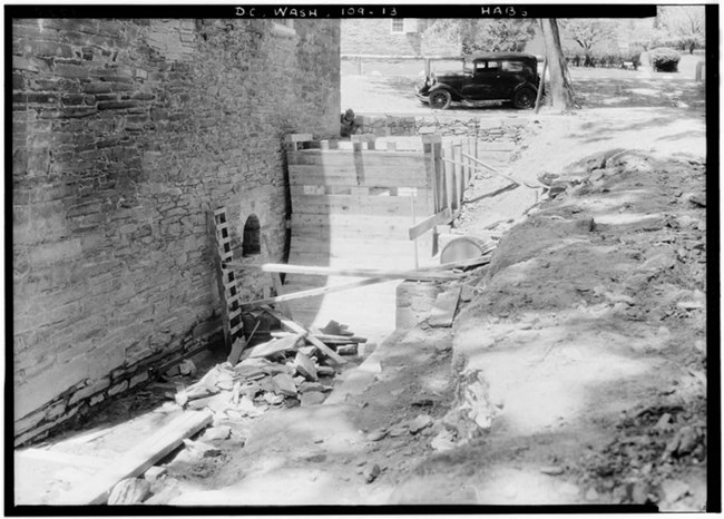 Photo of construction showing the wheel pit next to the mill