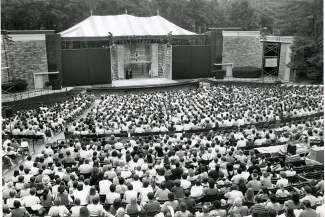 A crowd watches a performance onstage.