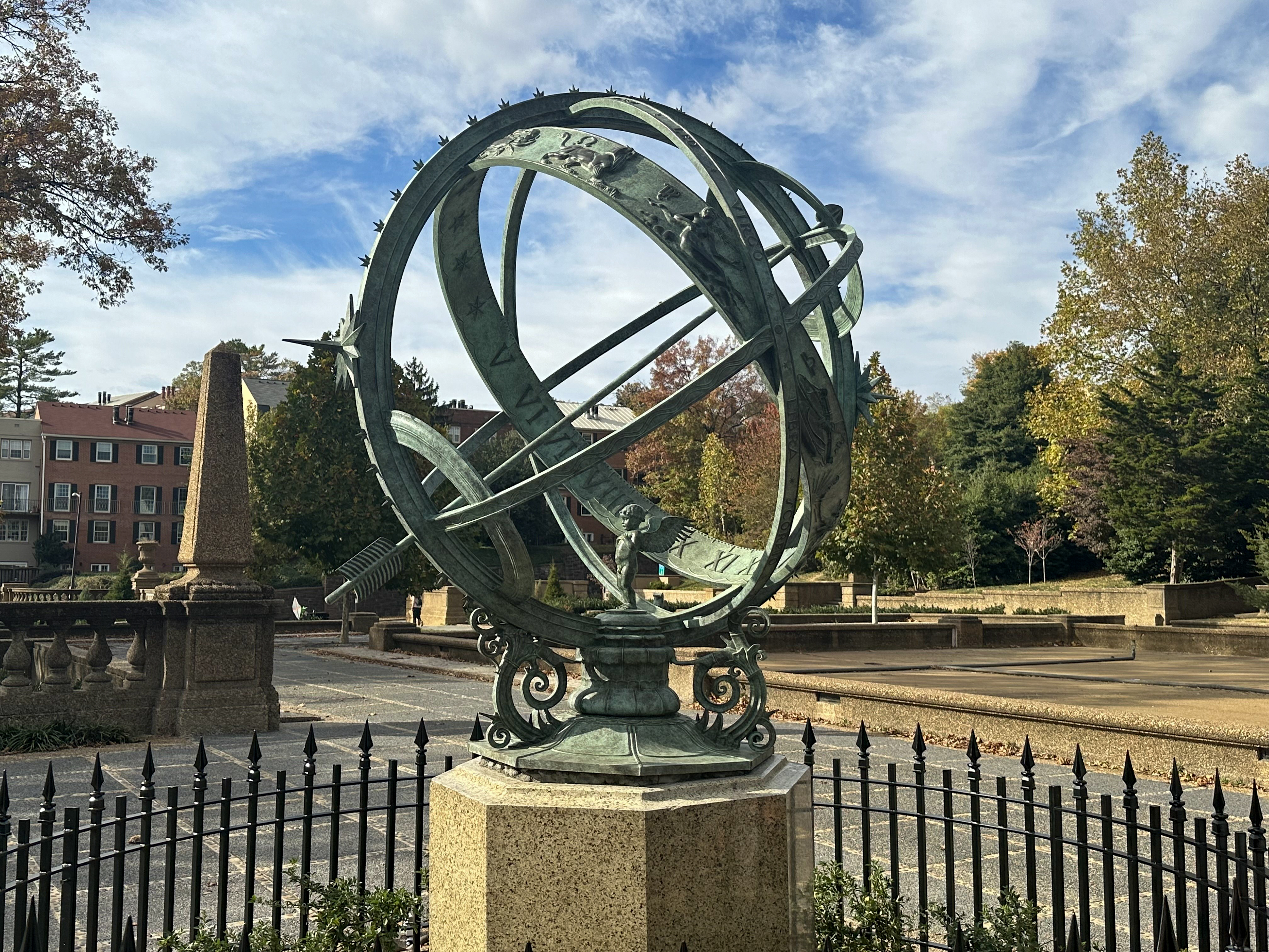 new armillary sphere at Meridian Hill Park an armillary sphere with a fence around it