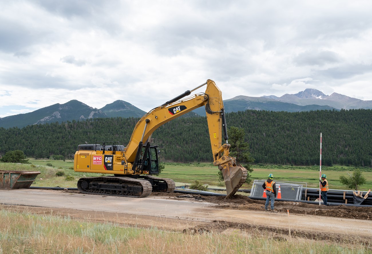 Digging a trench to lay down new water lines along Moraine Park Road