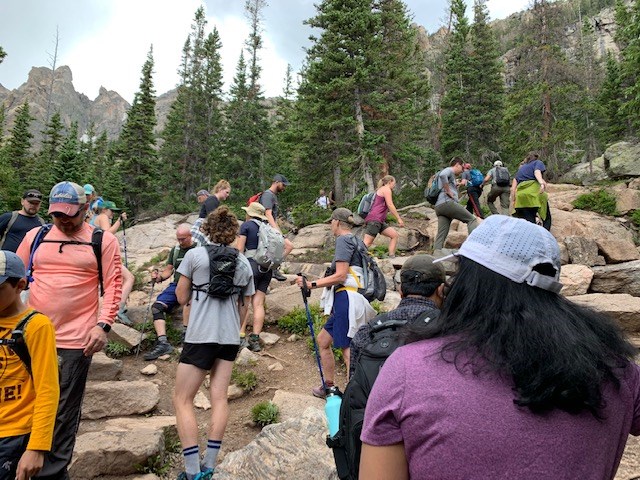 Visitors Hiking on a crowded trail in RMNP July 2021