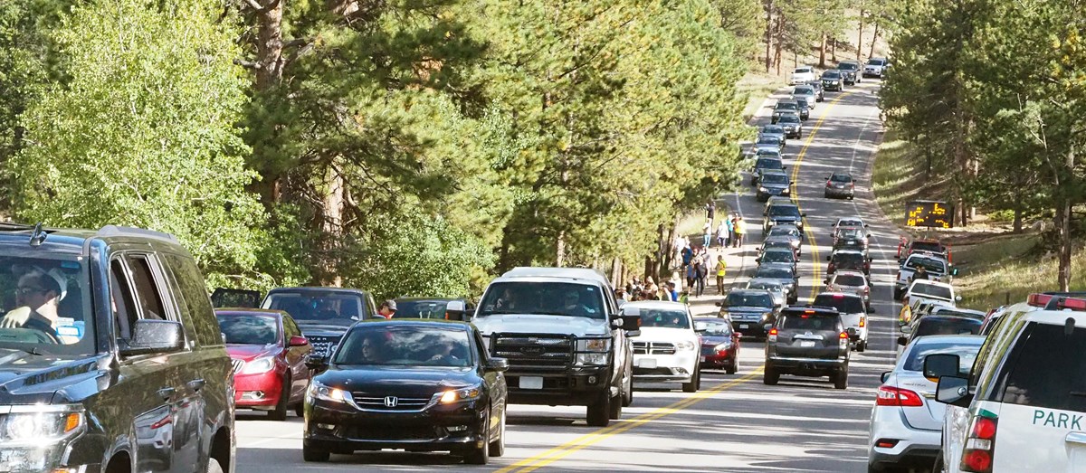 A line of traffic entering and exiting on Bear Lake Road
