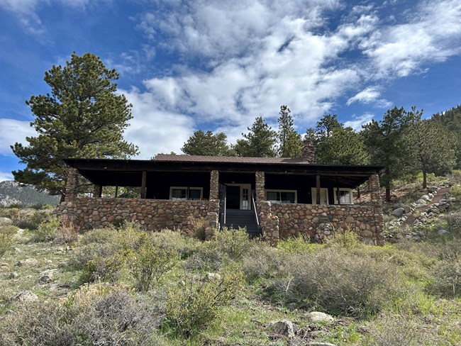 Front steps to a historic cabin in spring