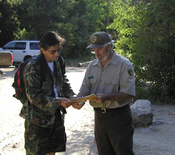 a photo of researcher doing wilderness use survey