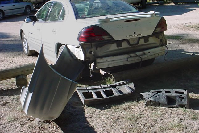 a photo of an auto that a bear damaged