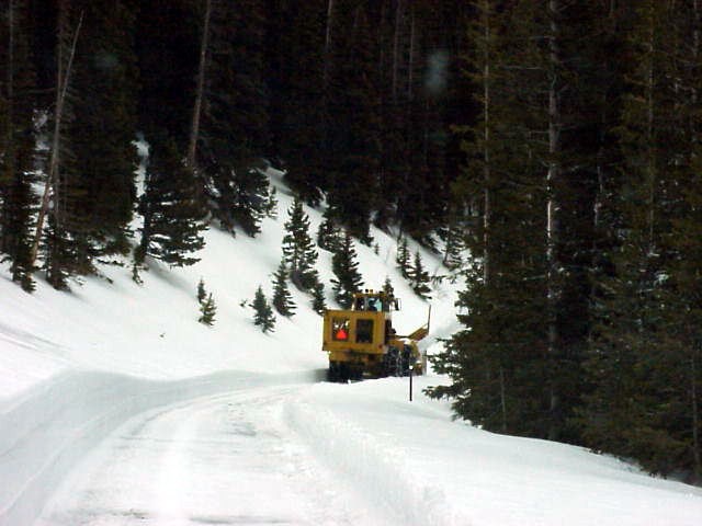 a photo of a snowplow heading home