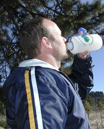 a photo of a visitor drinking water