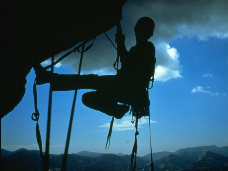 a photo of a climber on an overhang