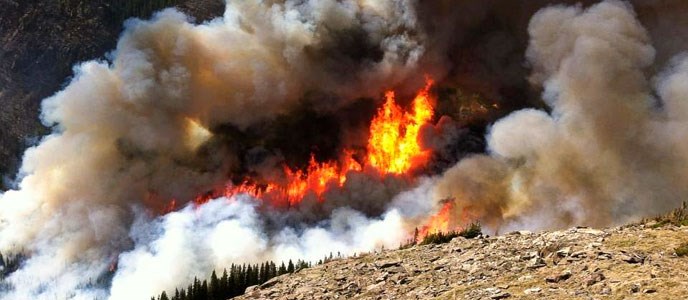 Flames and smoke on a mountain side Flames and smoke on a mountain side