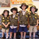 Kids with Junior Ranger vests smile